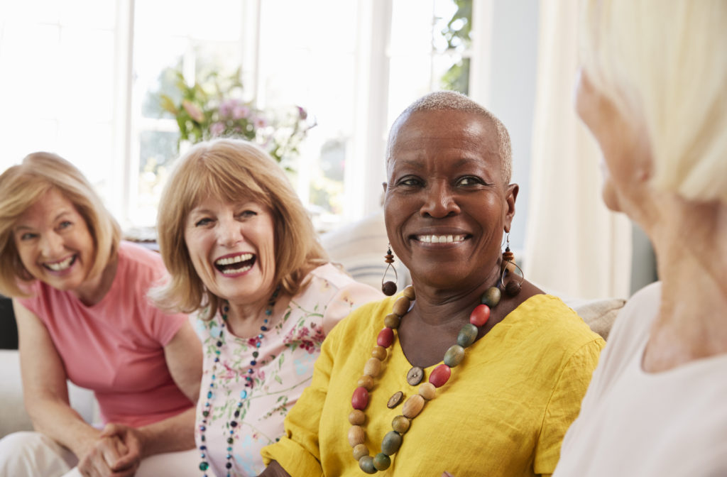 Senior women sitting together and socializing in senior community